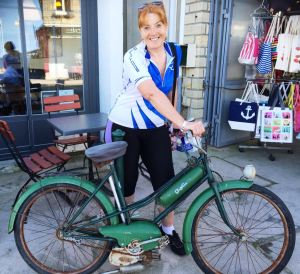 An old military bicycle caught they eye of the "old gal" in a shop display in Arromanches.